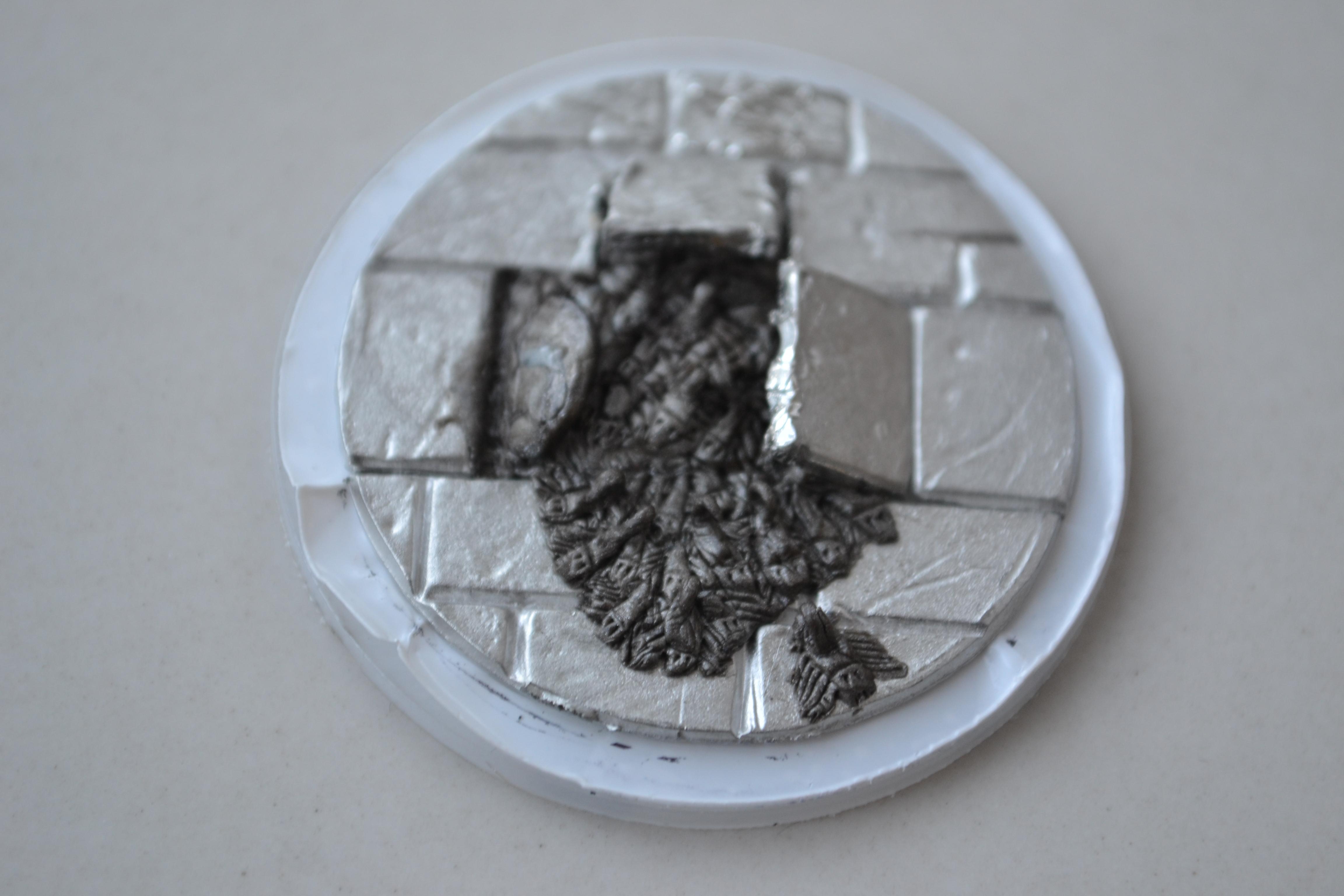 I cut a circle out of the perspex base cover then sculpted the scorpions straight onto it. This mean the edge of the base would be protected from paint
