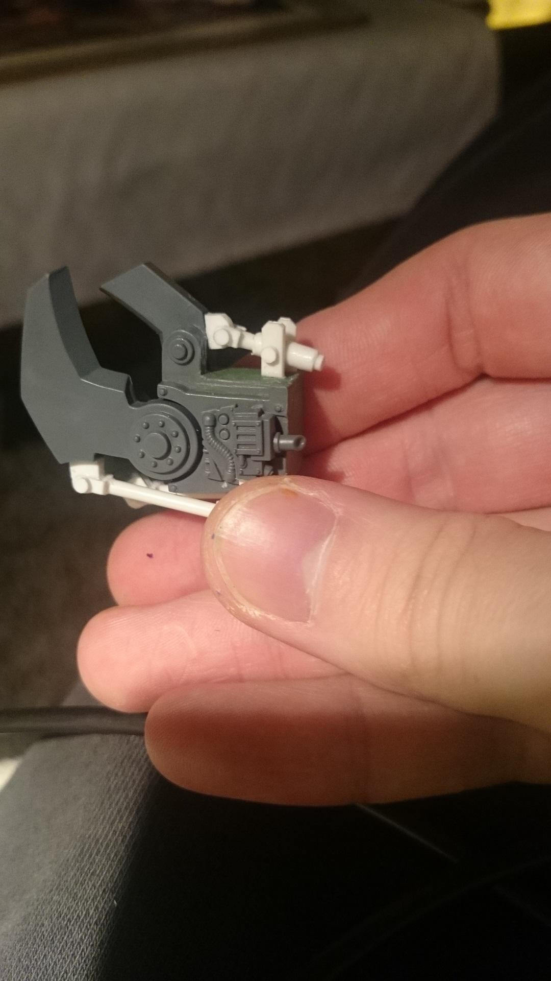 Trimmed down the claw and put on some pistons and bits to make it more orky
