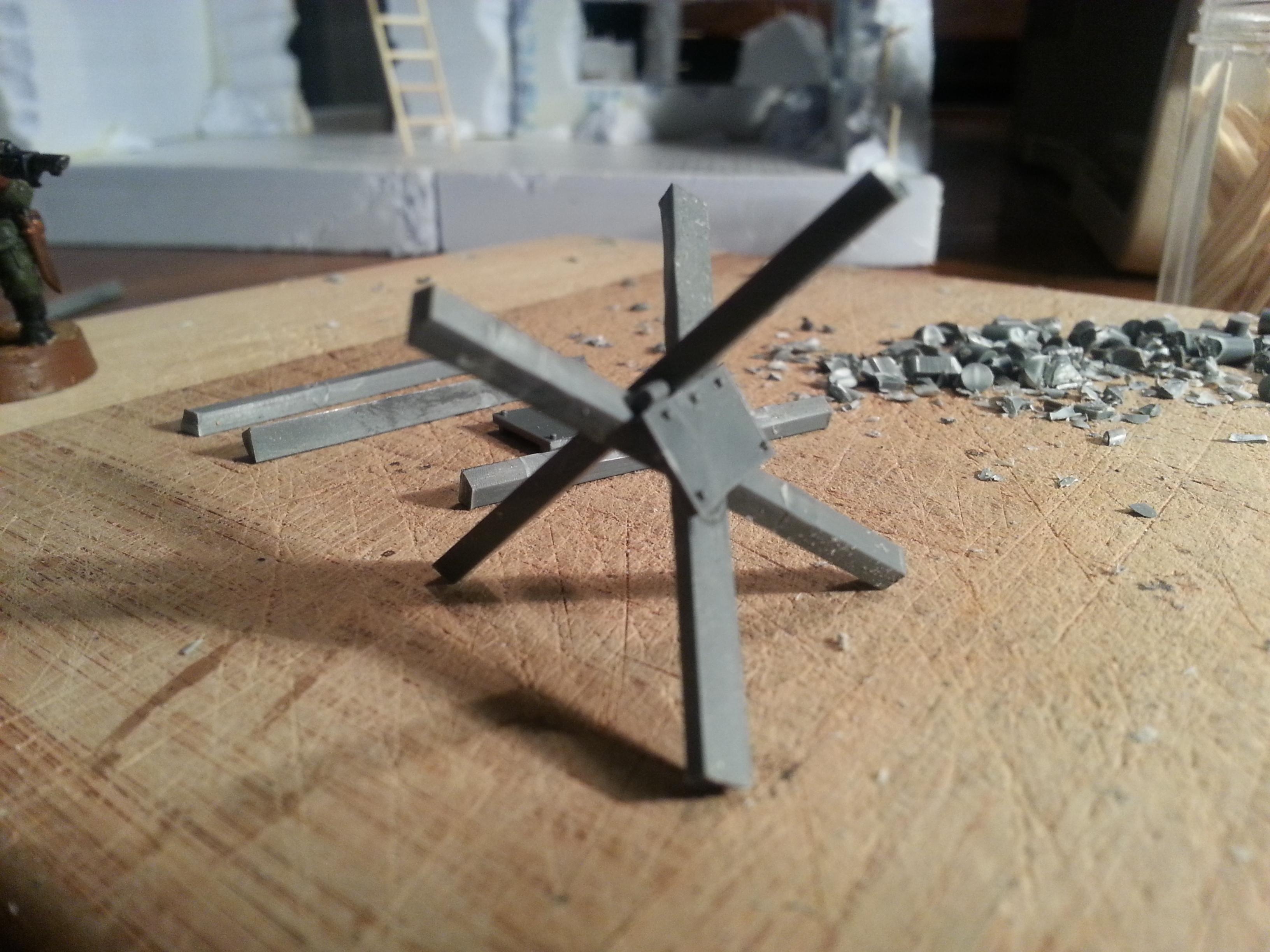 Remove the middle hinge and the back lips from the plate and glue it to the X