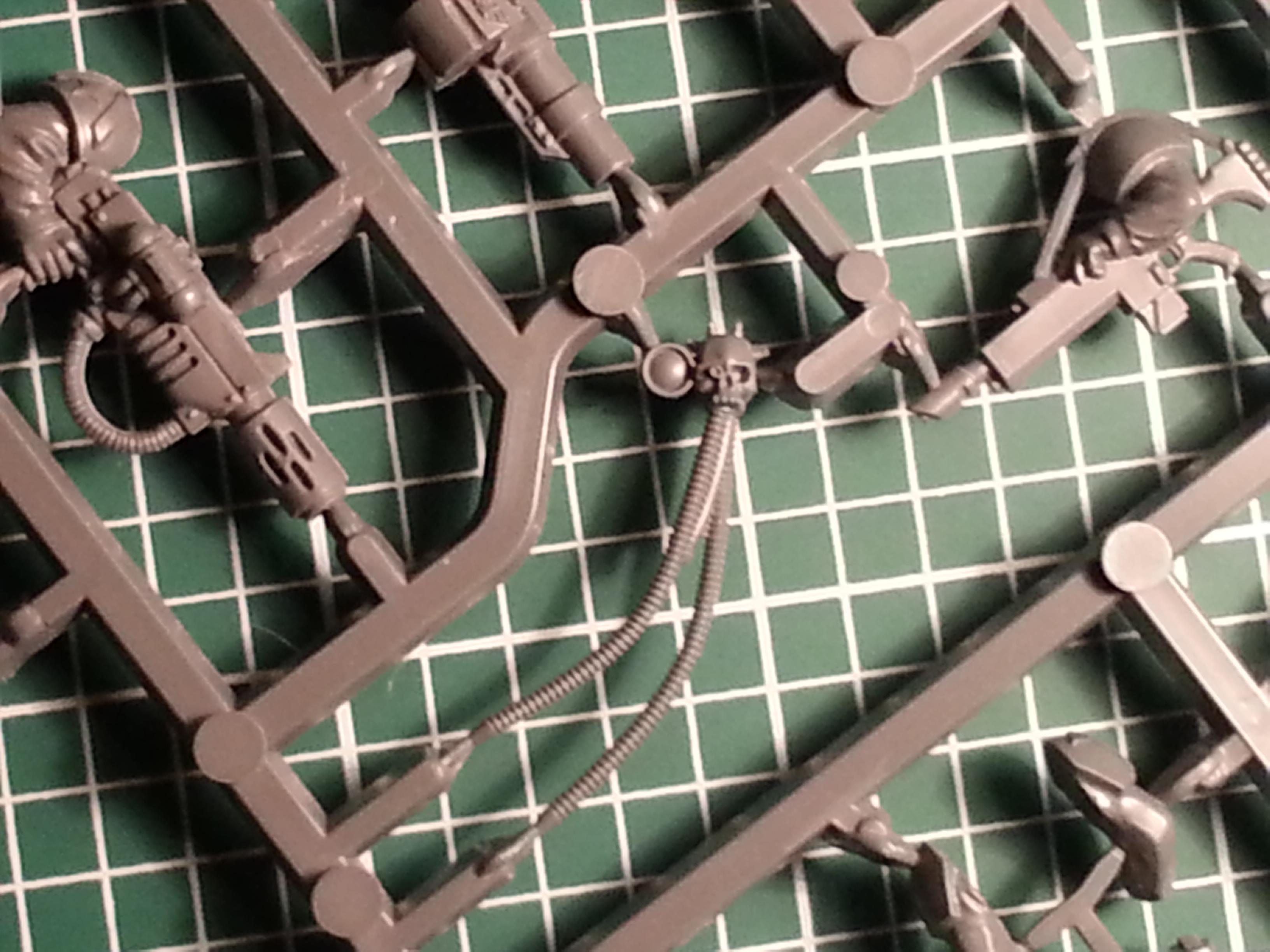 i used the occular implant and the lens from a servoskull from a CCS sprues and glued it to the head. 