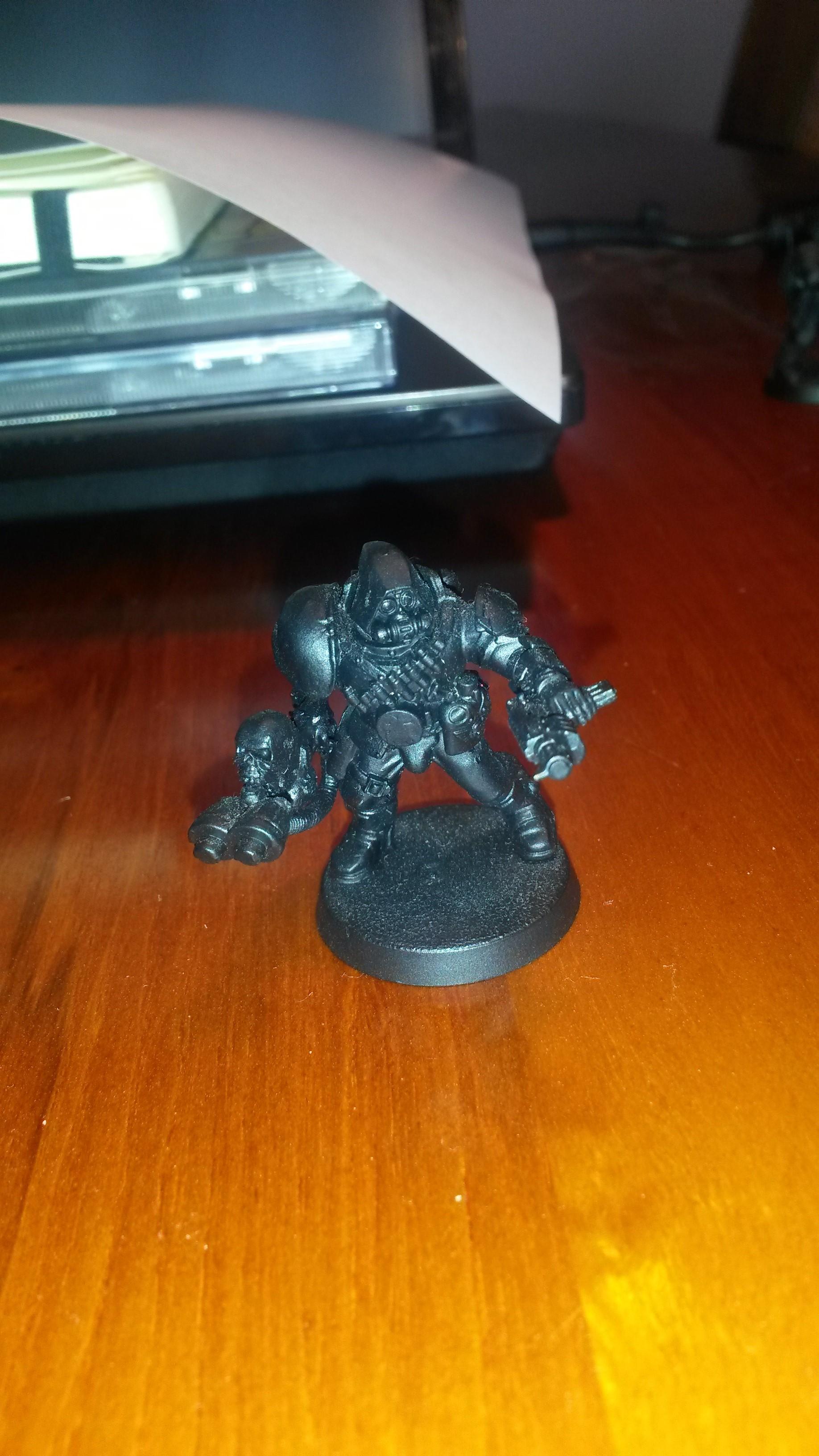 Scout legs, berzerker torso, eldar flamer arm, cultist autopistol, skitarii hood