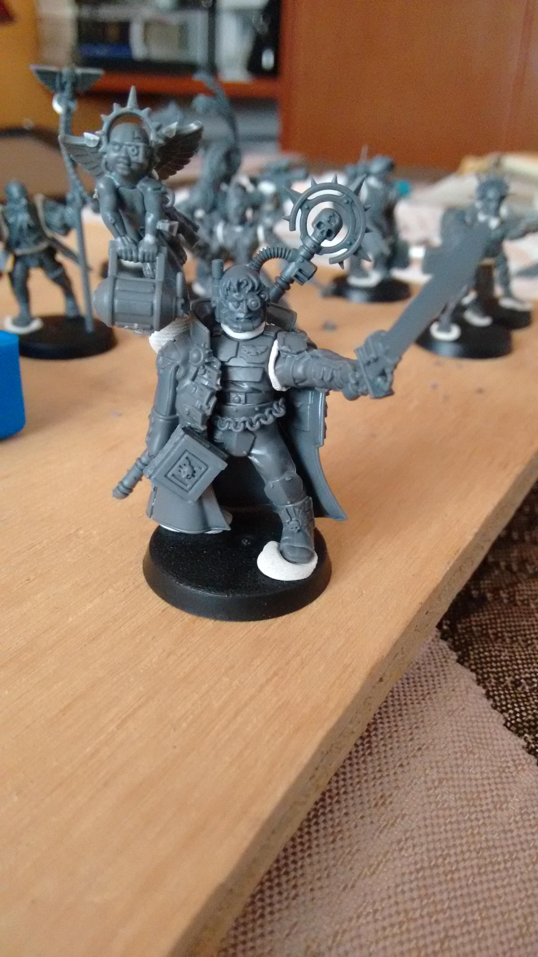 My inquisitor, recently added a hellpistol and a bionic leg, will update later