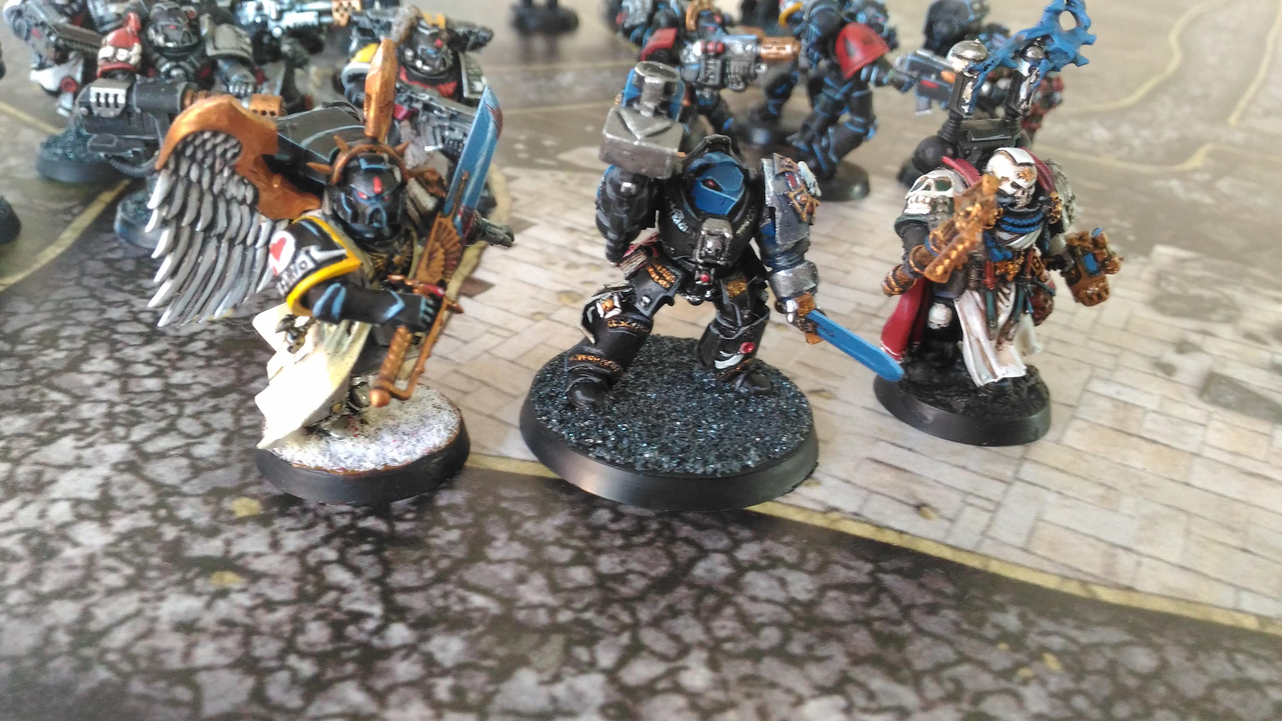 Command structure of the Killteam. Captain Aurelio, from the Lamenters; Captain Soprano, from the Ultramarines; and Chaplain Moebius, from the Dark Angels