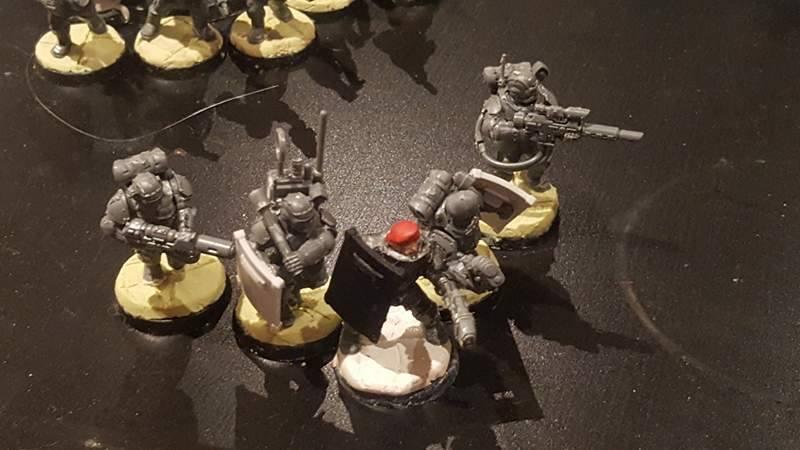Arbites Breaching team, suppresion shields, Plasma Pistol, Plasma Gun, and Melta Gun