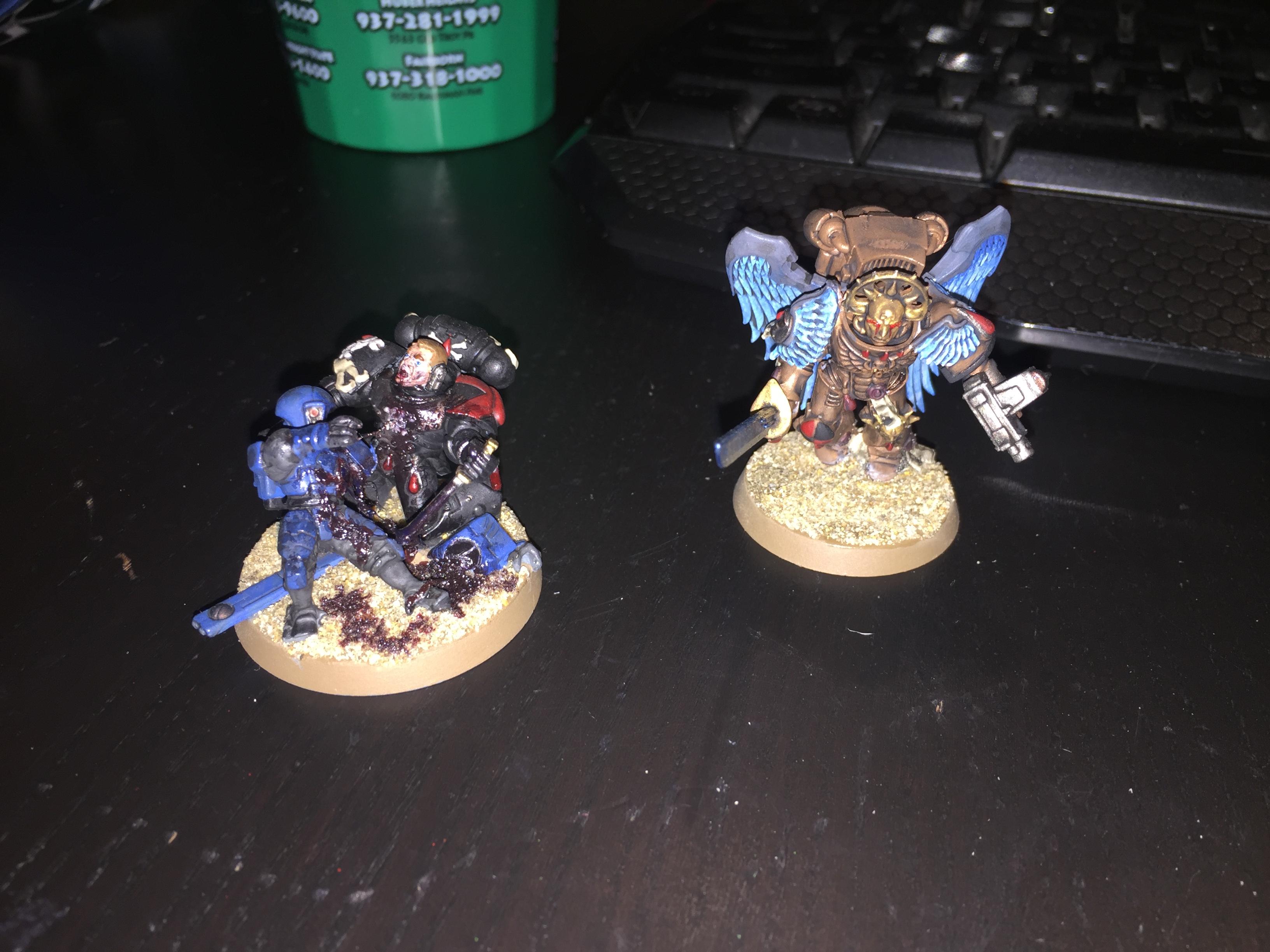 Blood Angels (the one on the left is eating a Tau)