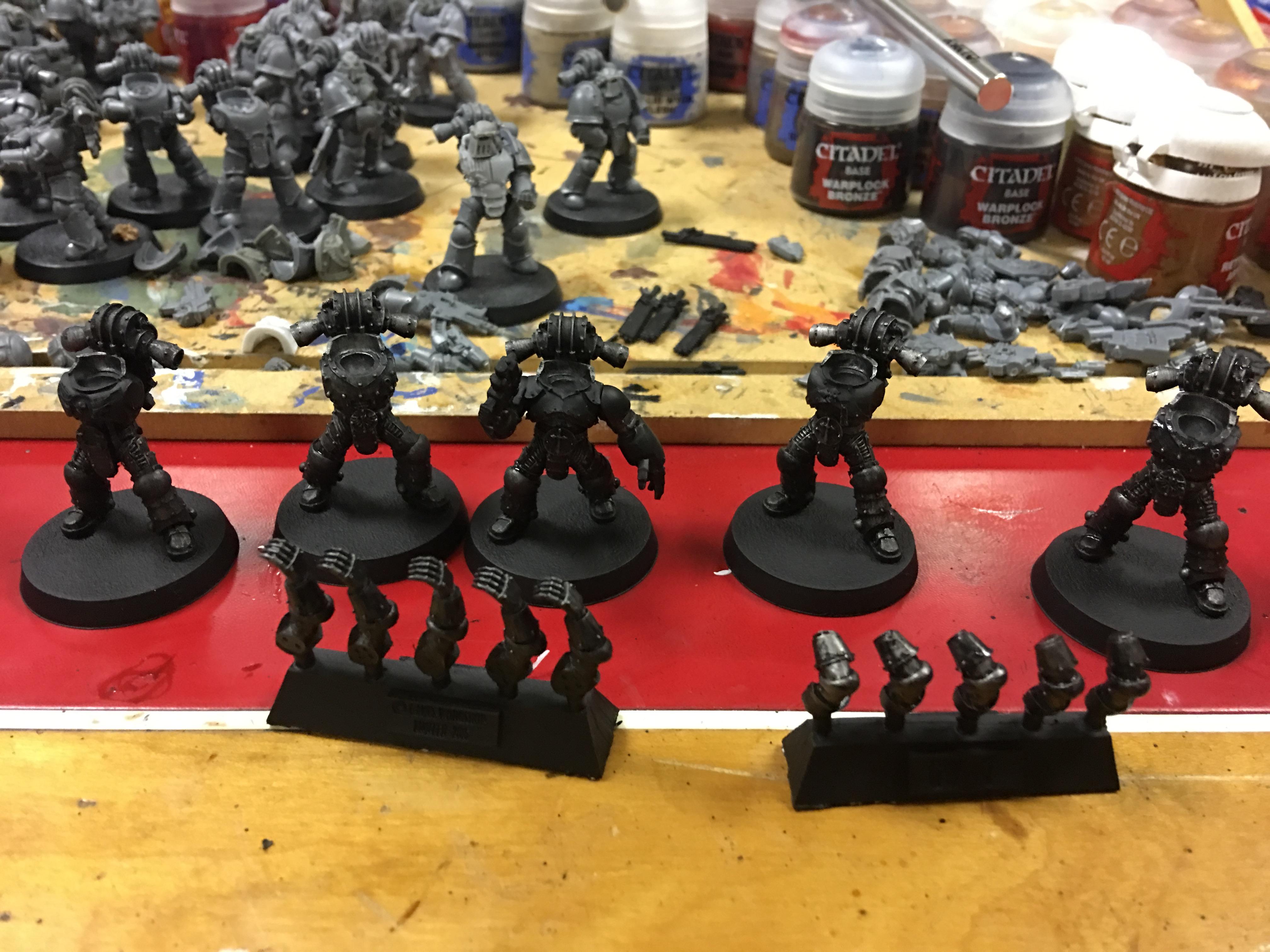 black wash to mute the silver and look more like worn down black than damage