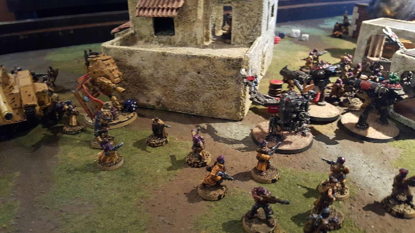 Tallarn infantry tie down orc walkers while tanks and walkers advance