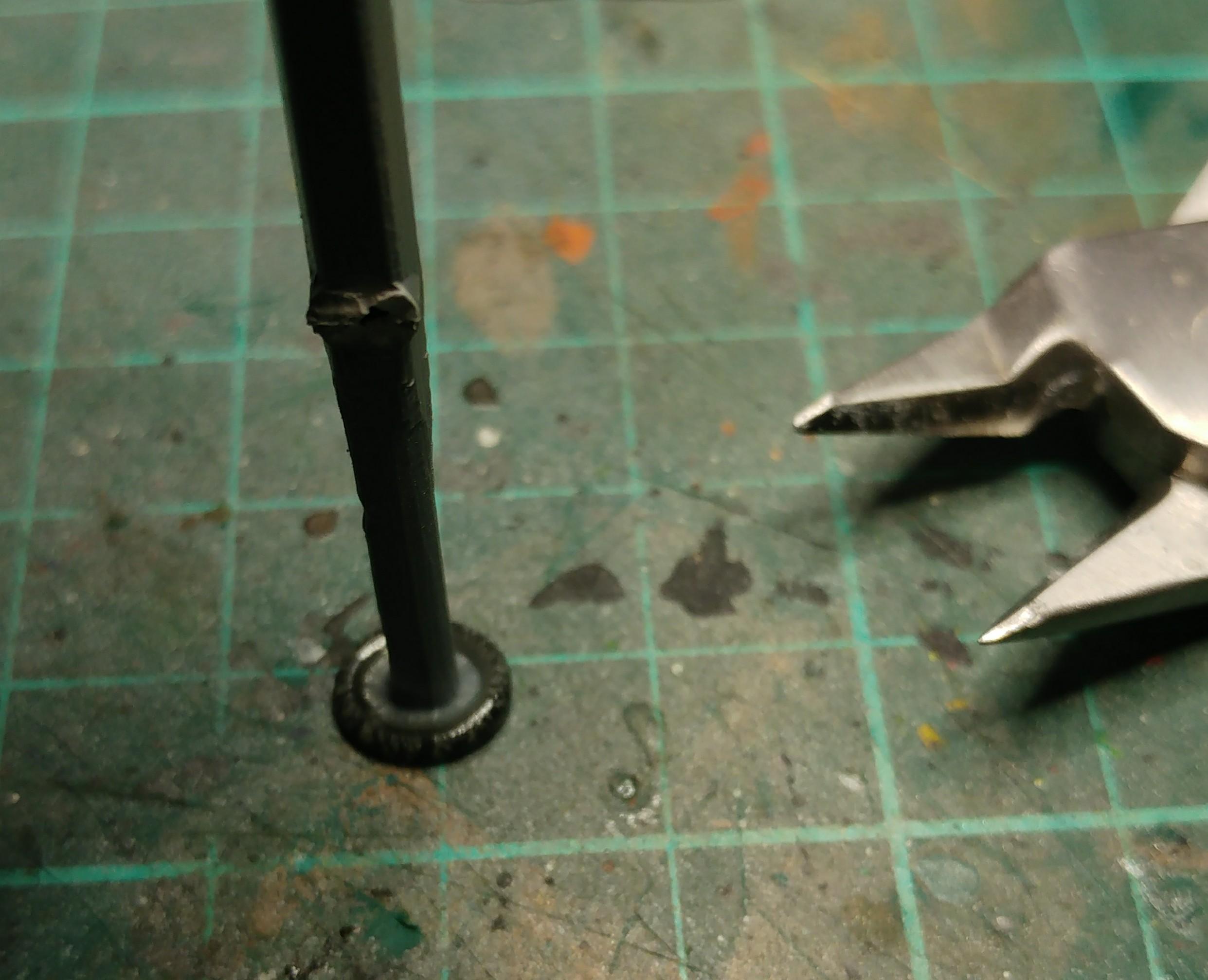 3 - (sprue) press the melted end onto a smooth surface