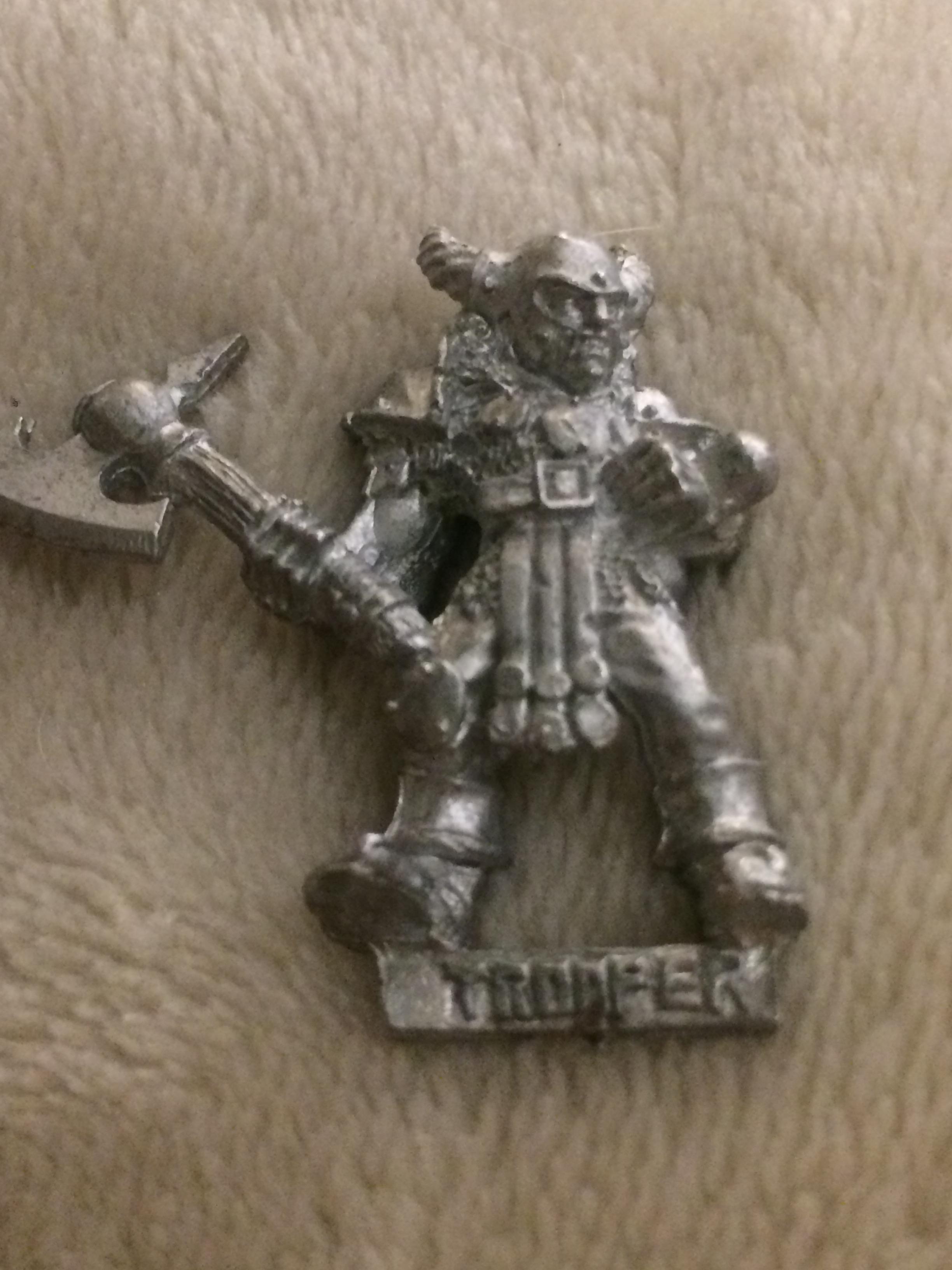 Front of the little dude. 