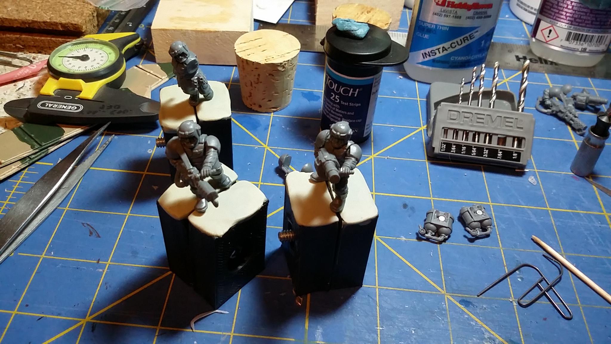 Cementing the hands, and awaiting drying before removing magnetic parts