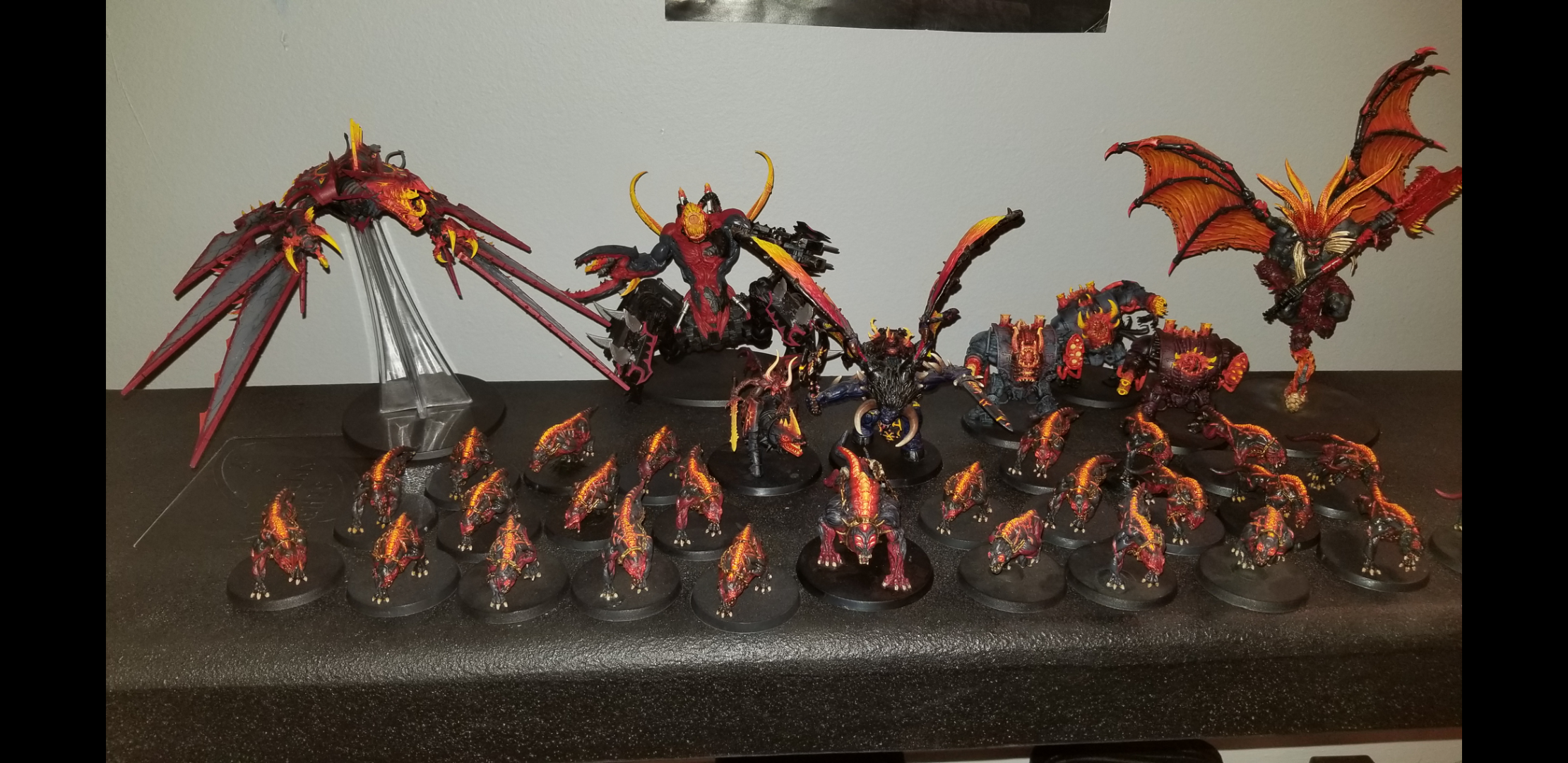 Here he is in an army besides other Fleshhounds for size comparison
