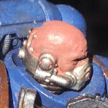 Rather overly-pink bald head