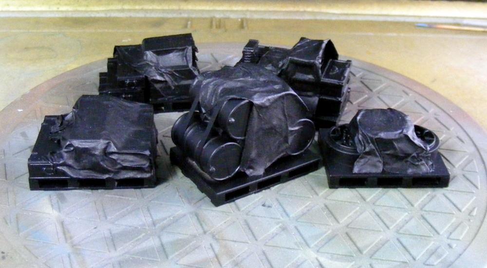 loaded pallets w/ tarpaulins