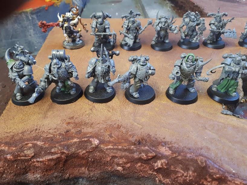 6 plague marines converted with primaris. Used leftover bits from a plague marine box. 