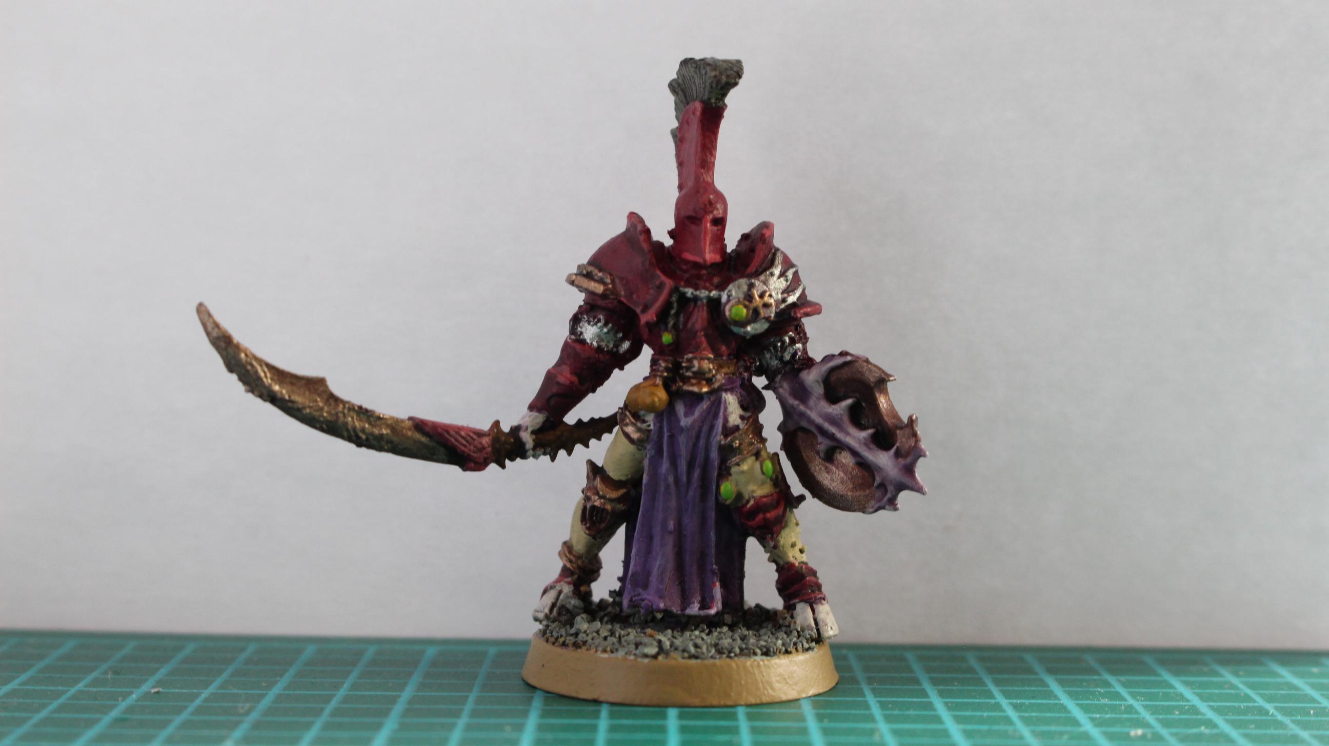 Champion of Slaanesh. Body is the old Slaanesh champion on foot with the head from the mounted champion. Can't remember where the sword is from