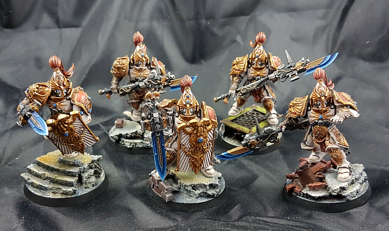 Image Description: My second box of custodes, painted in the Solar Watch sc...