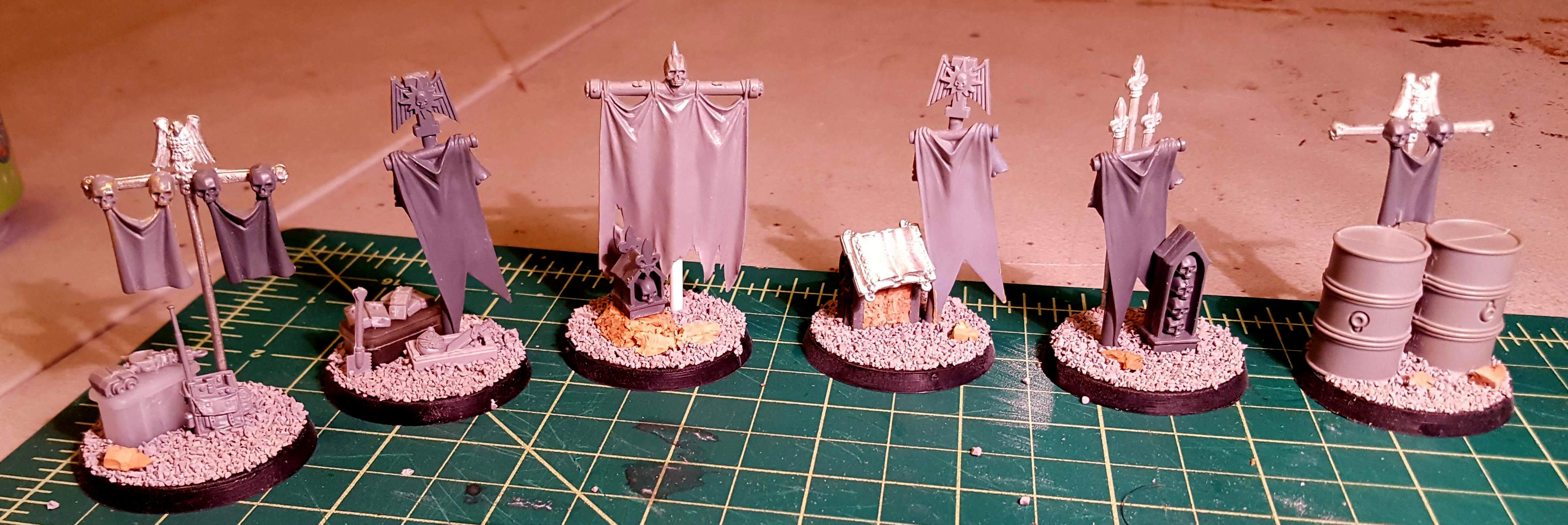 Six objective markers, ready for paint