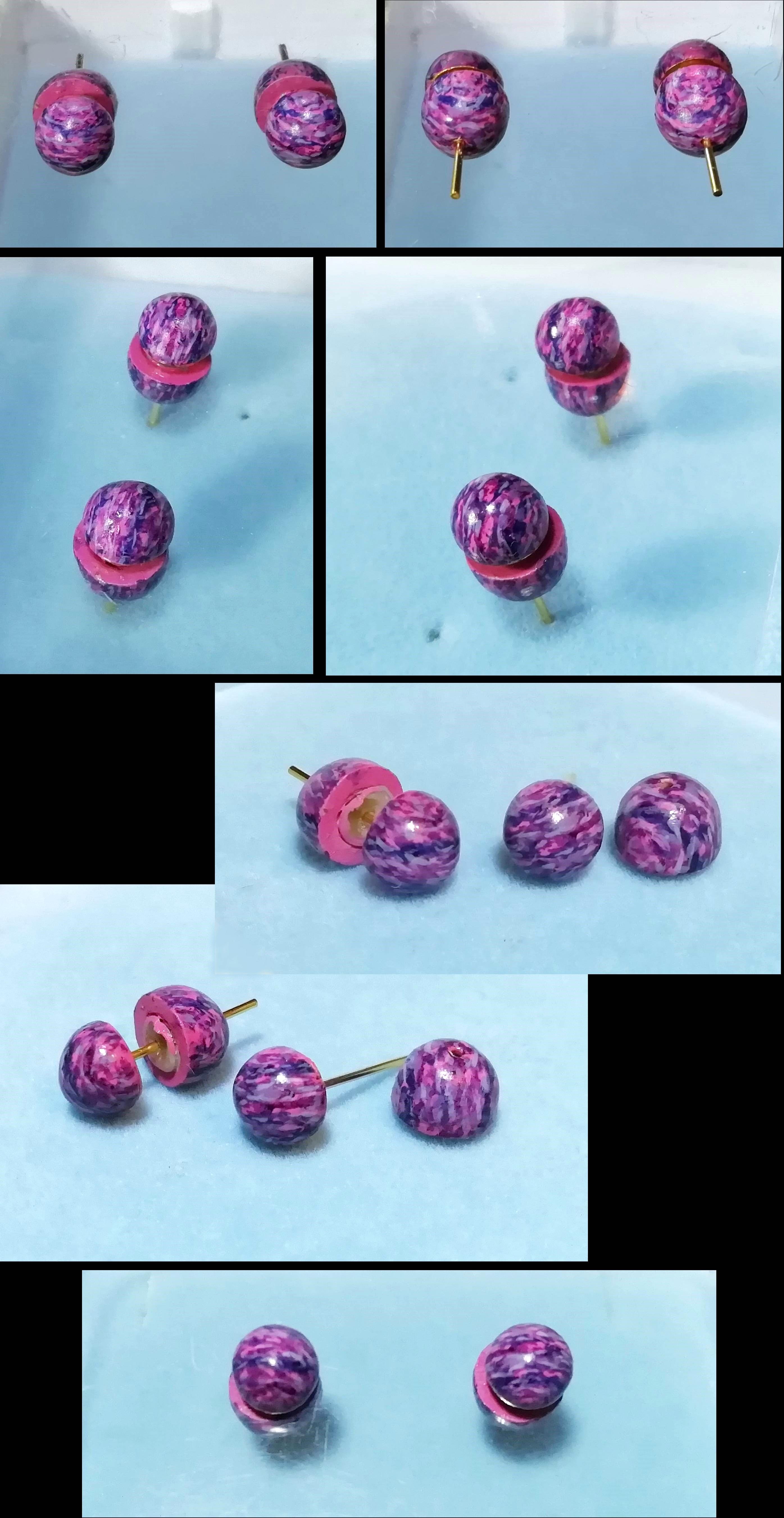 A pair of purple planet earrings