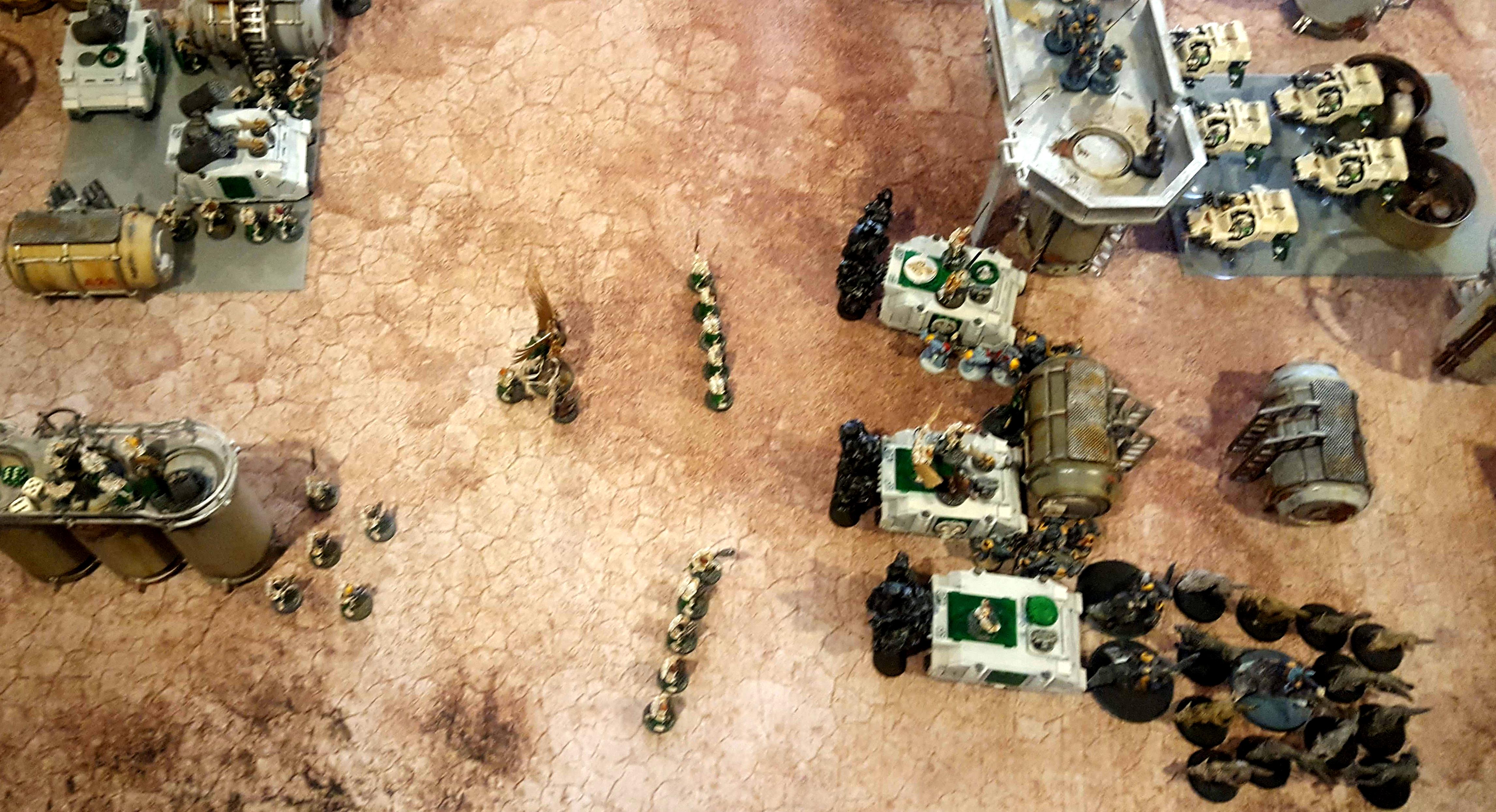 Dismbarked stormbolters open up on the Space wolves as the Rhinos surge forward