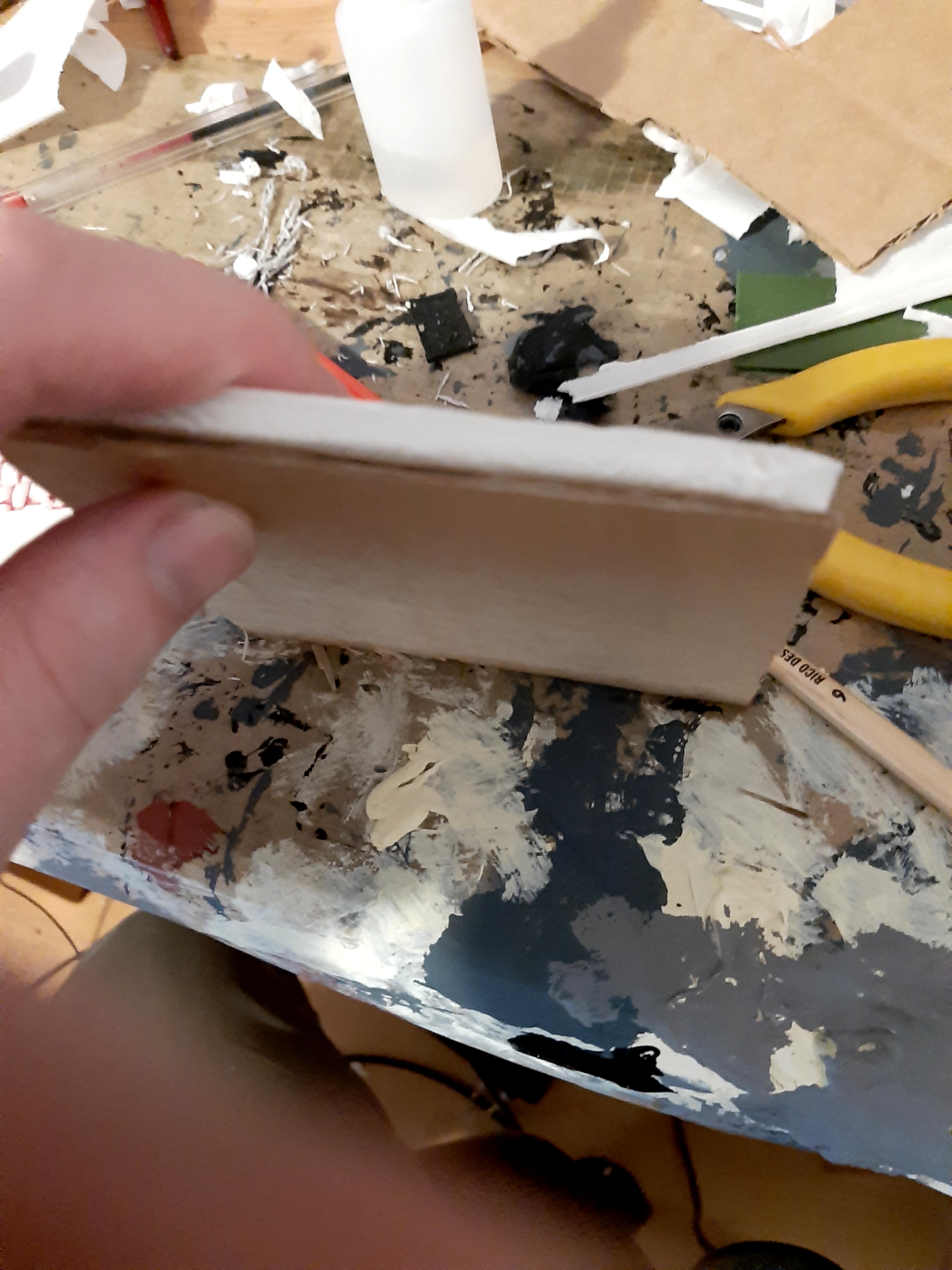Tile with cardboard bottom