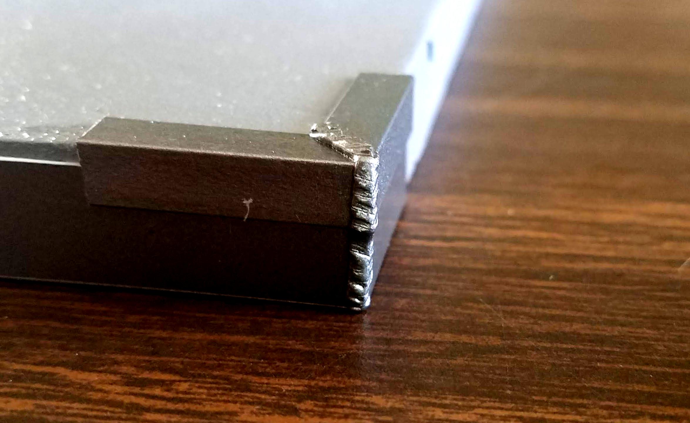 Close-up of green stuff &quot;welds&quot; painted with Leadbelcher
