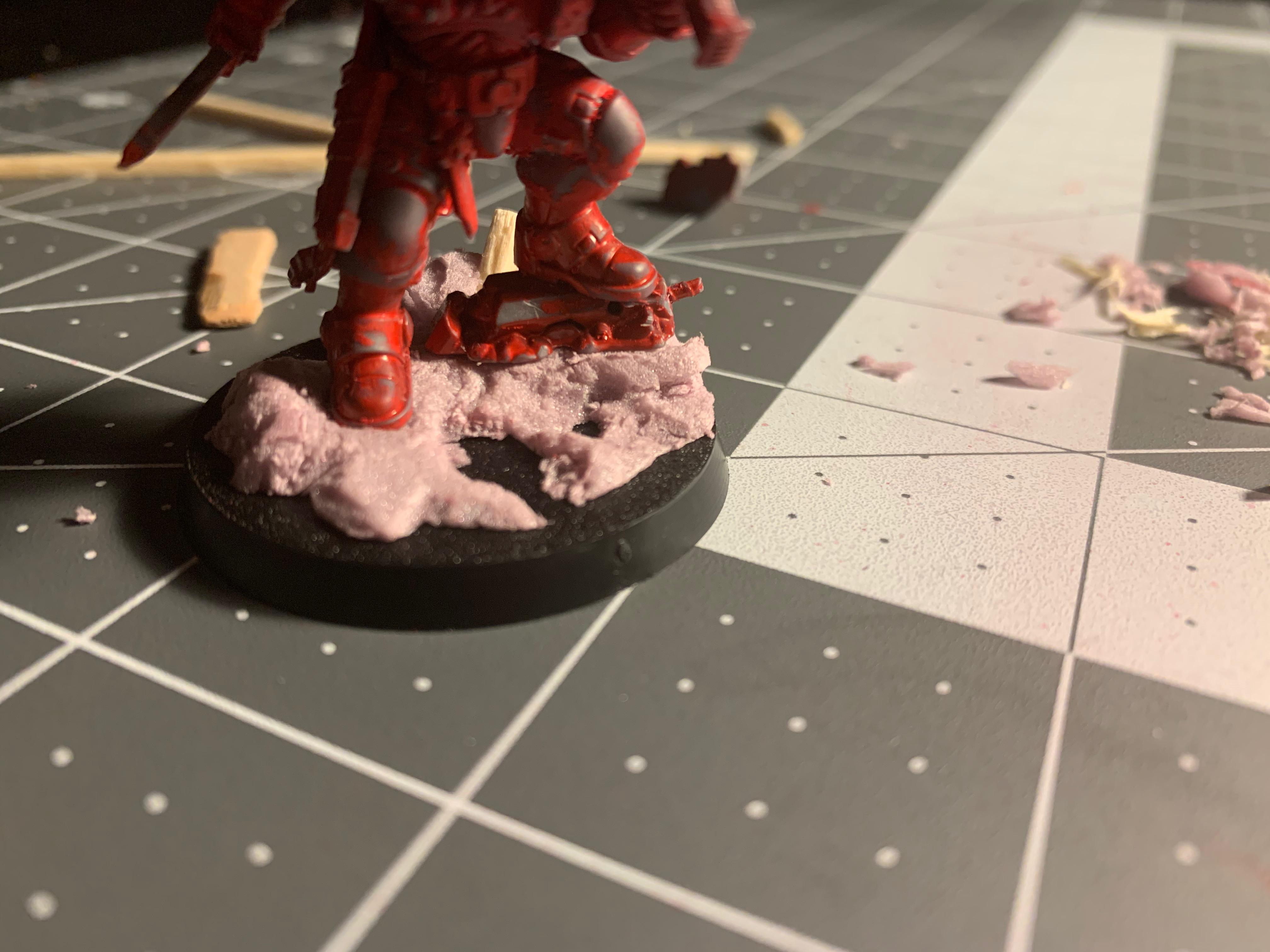 Placing the Lt on the base, trying to carve the pink stuff with care
