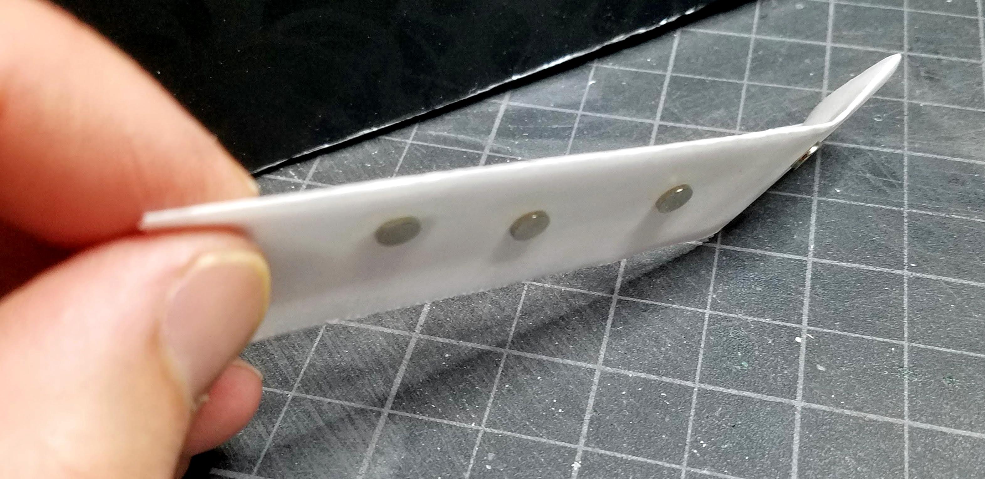 Magnets sandwiched around parchment paper