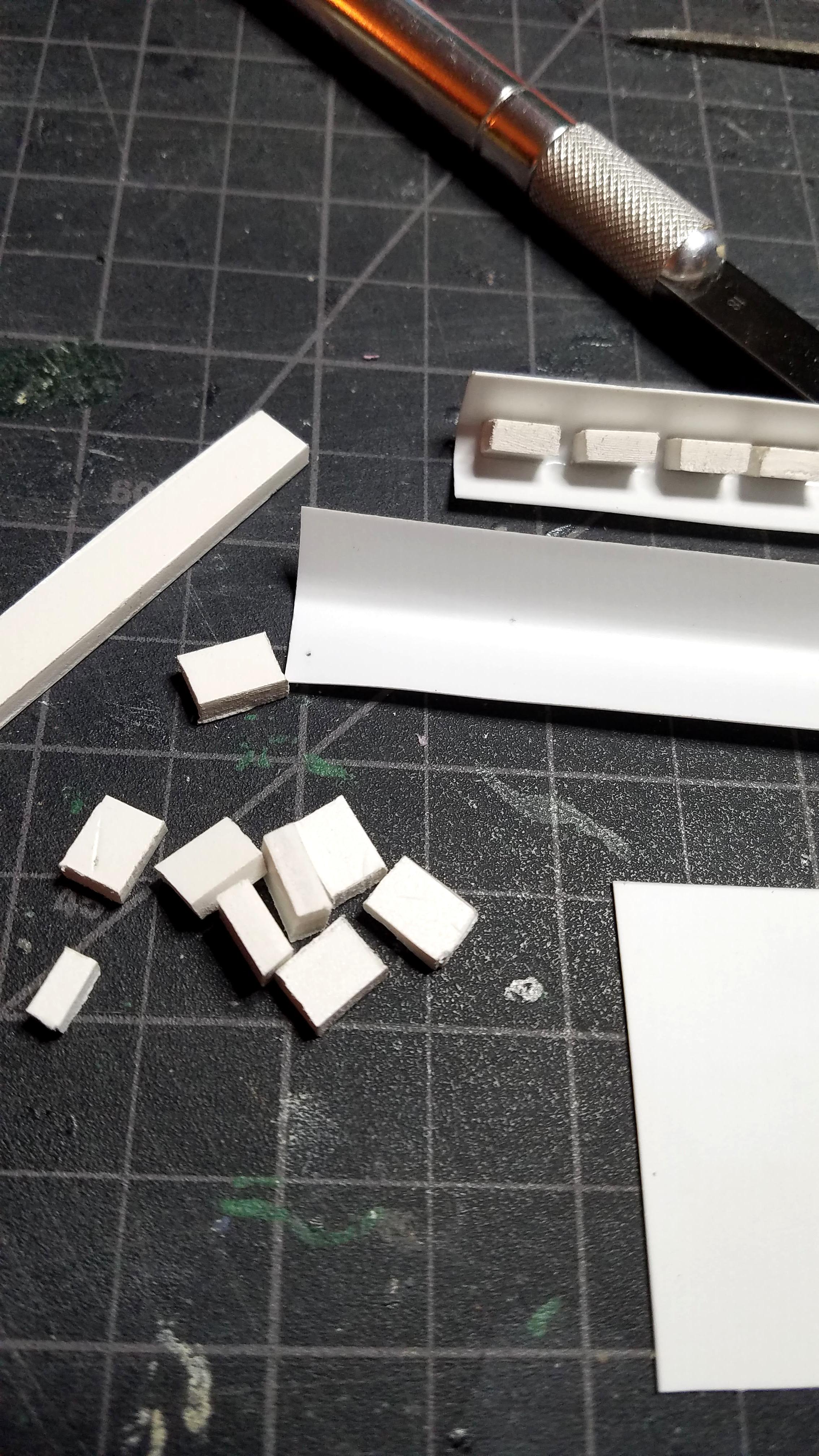 Assembling books of foamed PVC and styrene card