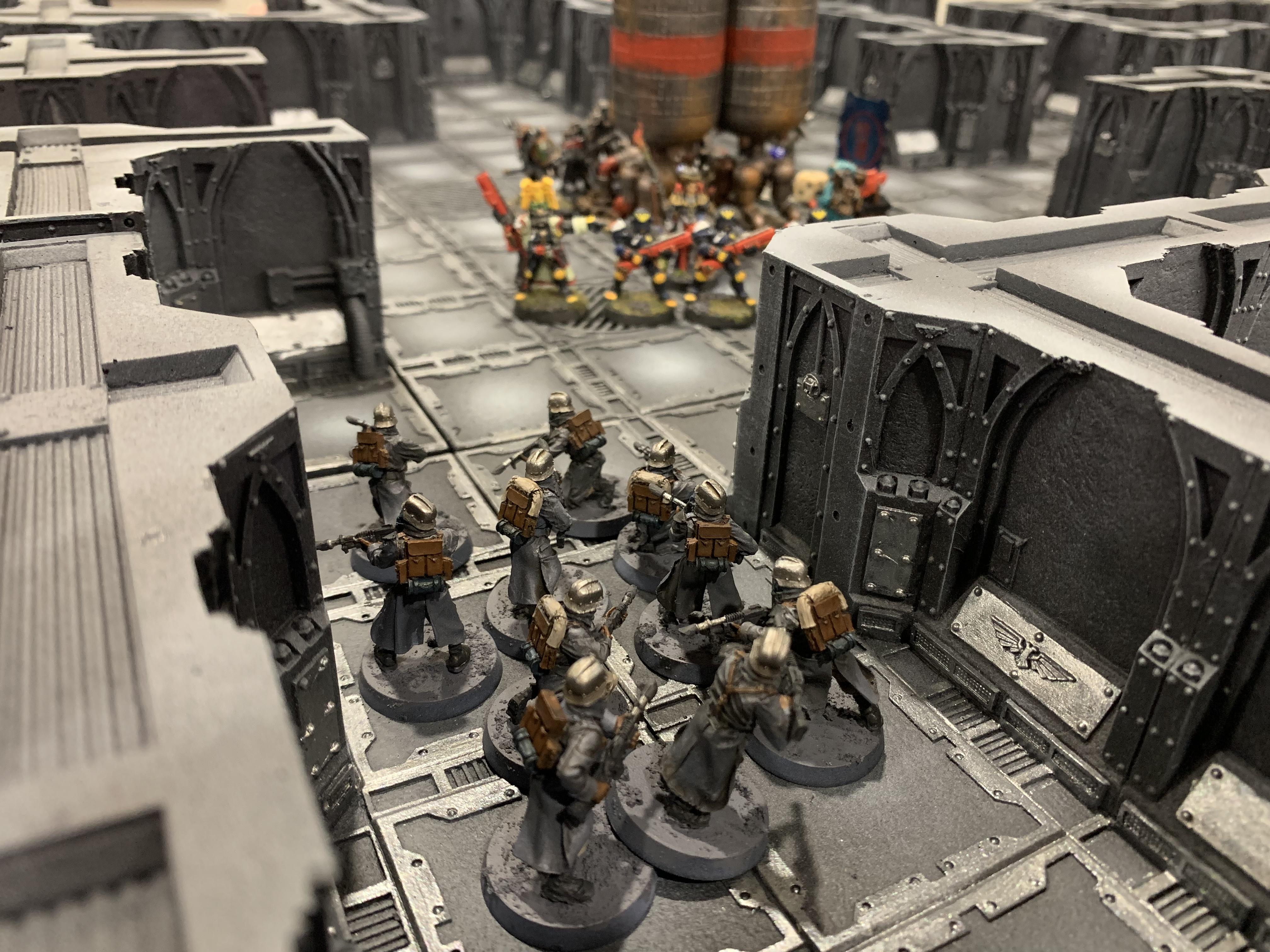  Inquisitor and acolytes protect engineseer as he downloads data. 