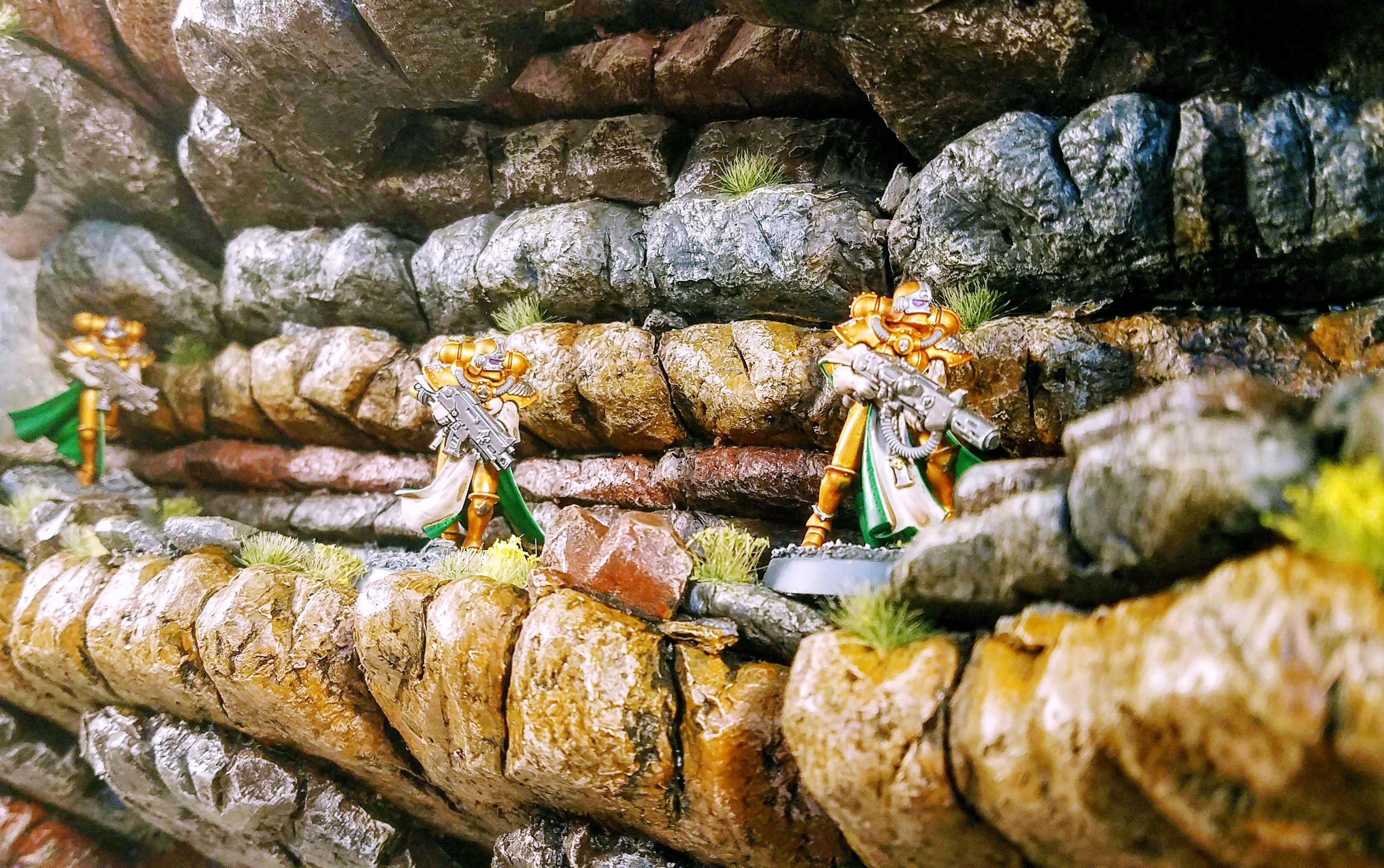 Models traversing the ledge for scale