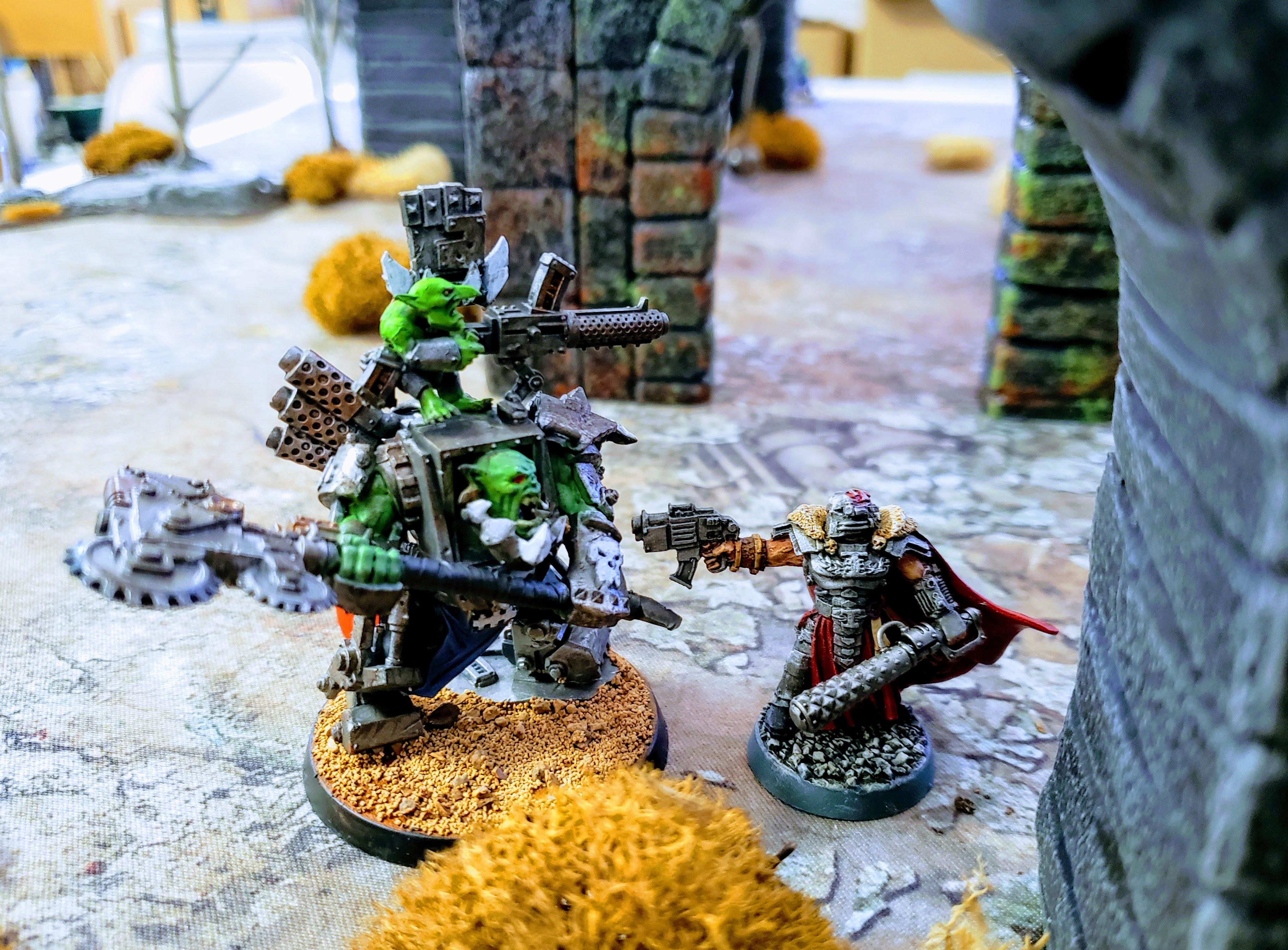 Inquisitor Grimhame, Ordo Xenos squares off against Warboss Denghar of the Deathskullz