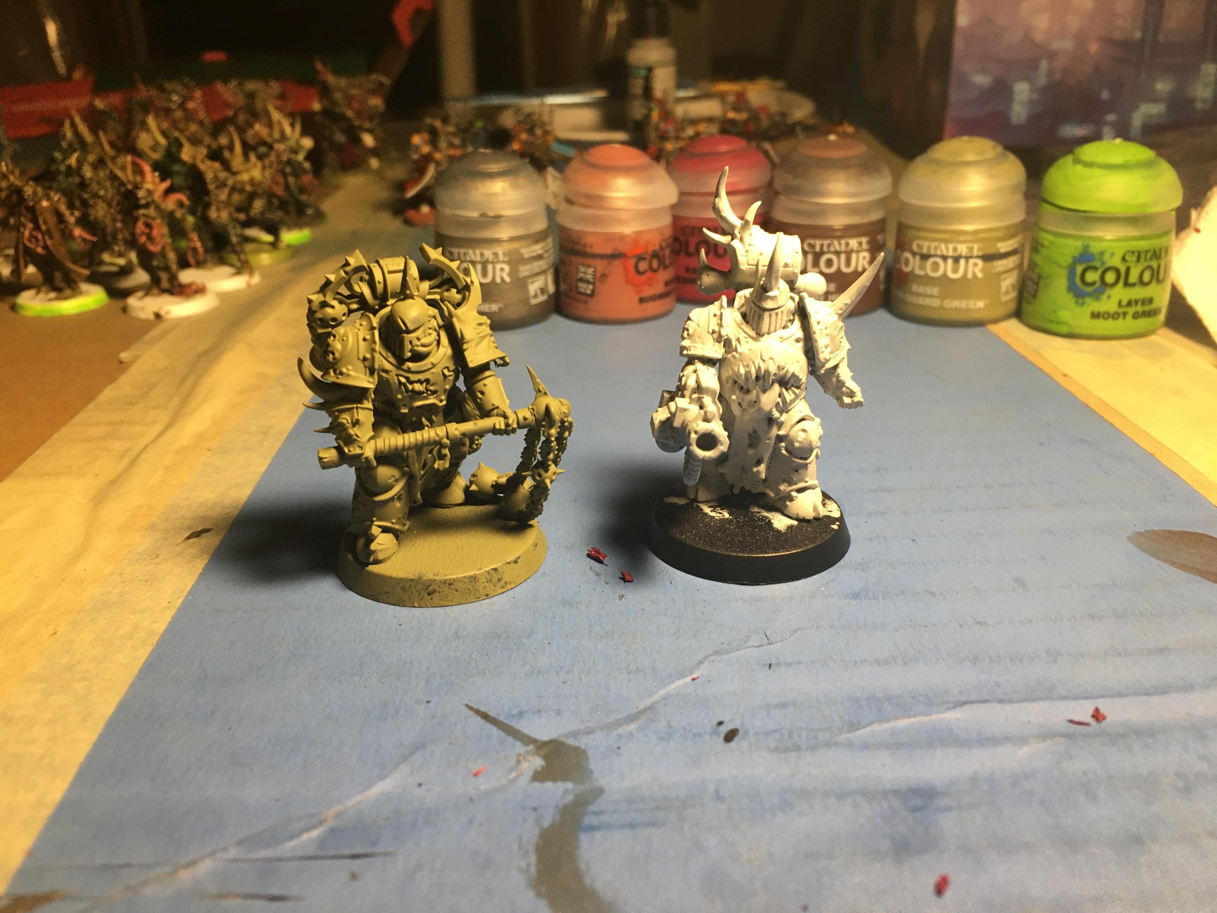 2 Plague Marines, One primed green w/ flail, one primed white w/ blight launcher