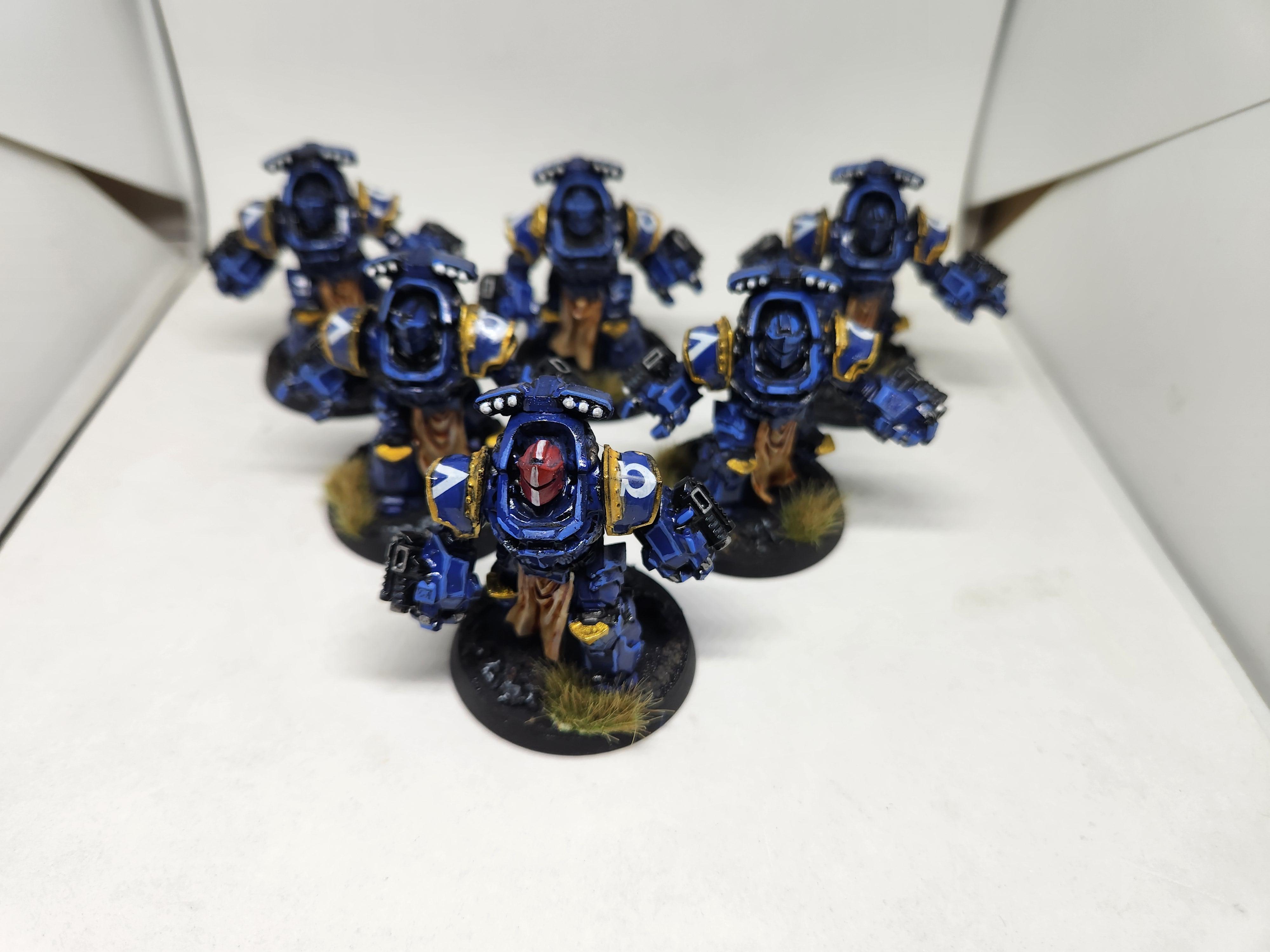 Ultramarines Aggressors with Boltstorm Gauntlets, after highlighting