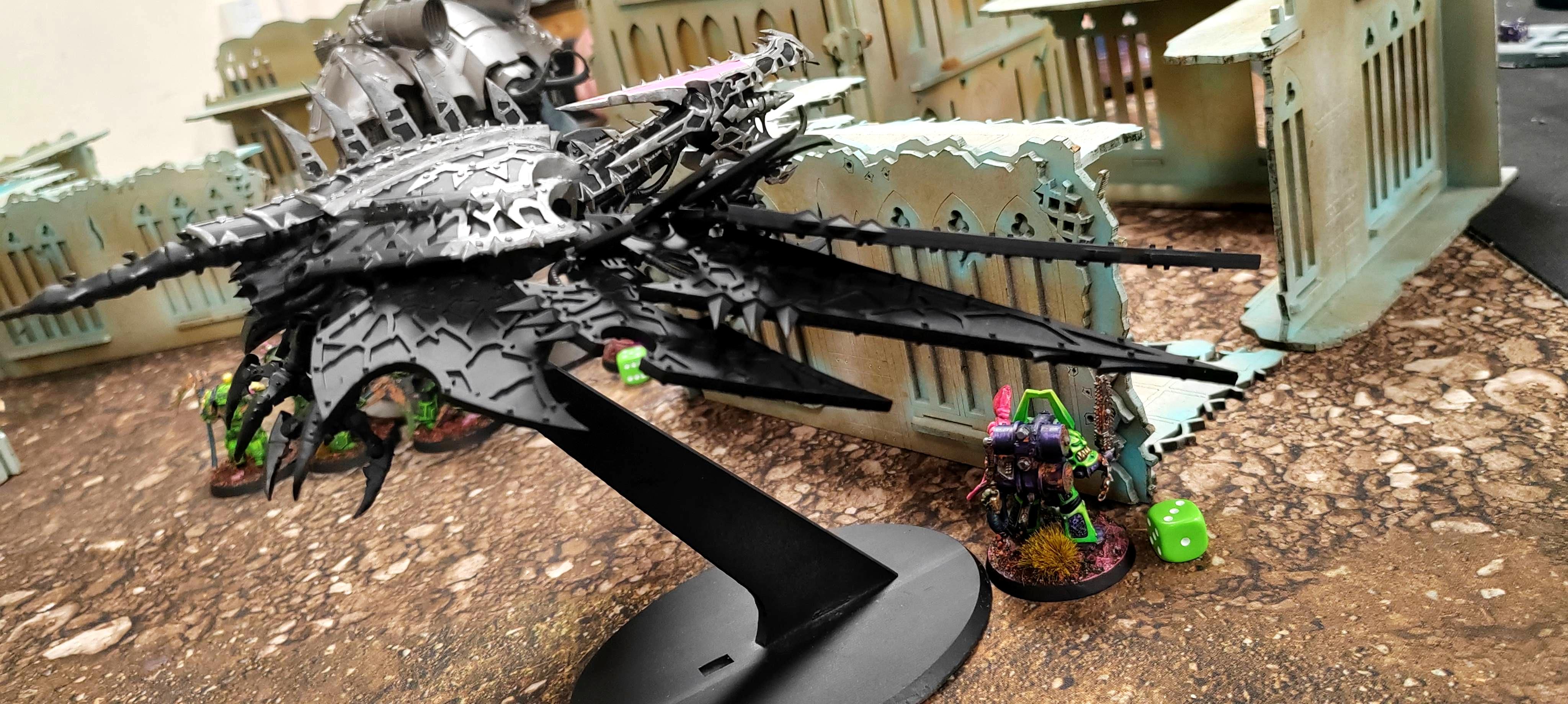A Helldrake batters through the Plague Marines